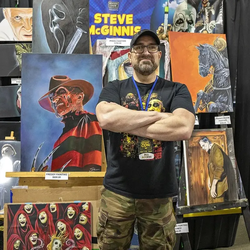 Horror artist Steve McGinnis at his convention booth representing vendors and artists